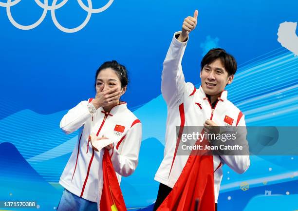 Wenjing Sui and Cong Han of Team China celebrate winning the Gold medal at 'kiss and cry' during the Pair Skating Free Skating on day fifteen of the...