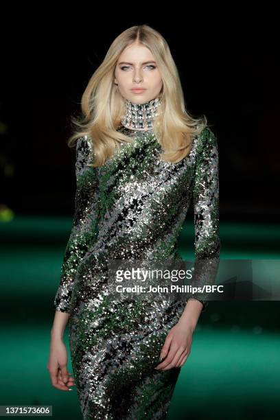 Model walks the runway at the HALPERN show during London Fashion Week February 2022 on February 19, 2022 in London, England.