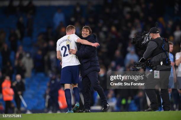 Antonio Conte, Manager of Tottenham Hotspur embraces Dejan Kulusevski after their sides victory in the Premier League match between Manchester City...