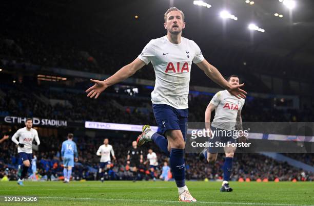 Harry Kane of Tottenham Hotspur celebrates after scoring their side's third goal during the Premier League match between Manchester City and...