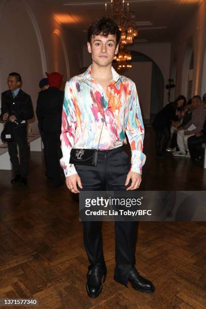 Tom Daley on the front row at the DANIEL w. FLETCHER show during London Fashion Week February 2022 on February 19, 2022 in London, England.