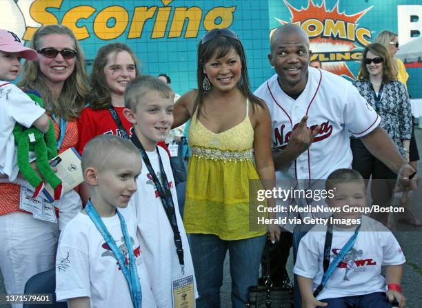 Hazel Mae and Darryl ""DMC"" McDaniels pose with kids from the Children's Hospital on the red carpet before the ""Becket Bowl Celebrity Bowling...