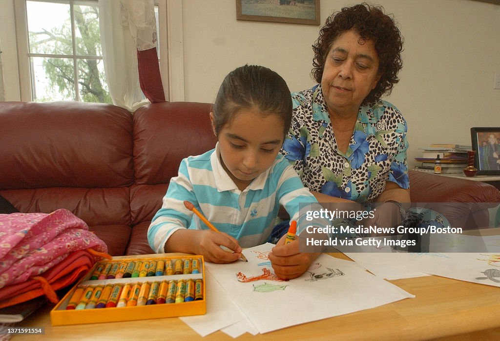 Rahil Hom BAYSTATE. Rahil Hamdi draws animals as her sponsor Razia jan looks on ...