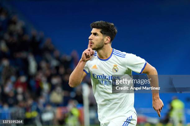 Marco Asensio of Real Madrid celebrates after scoring their team's first goal during the LaLiga Santander match between Real Madrid CF and Deportivo...