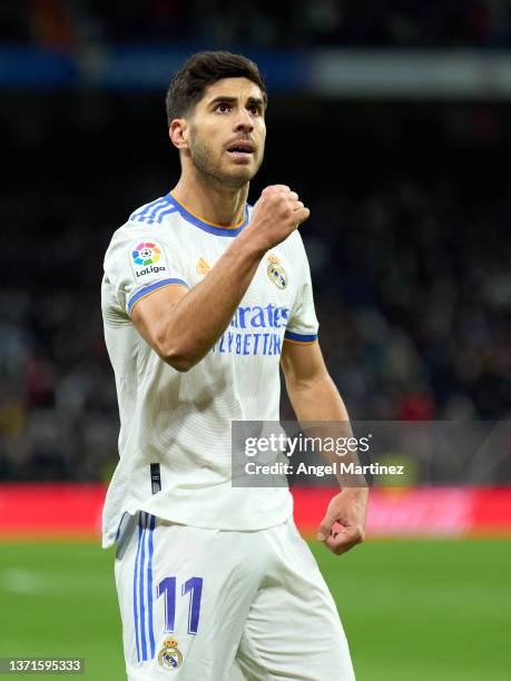 Marco Asensio of Real Madrid celebrates after scoring their team's first goal during the LaLiga Santander match between Real Madrid CF and Deportivo...