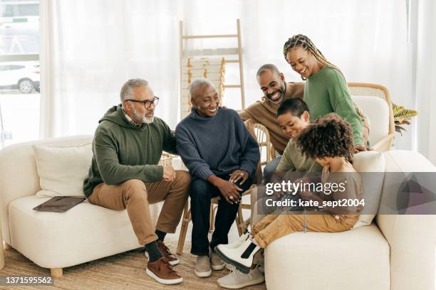 family traditions - three generations togeth - family gathering stock pictures, royalty-free photos & images