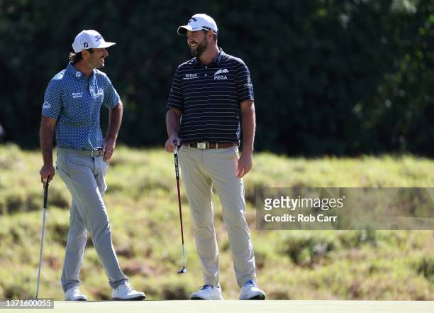 Max Homa of the United States and Marc Leishman of Australia laugh on the eighth green during the third round of The Genesis Invitational at Riviera...