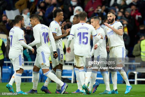 Karim Benzema of Real Madrid celebrates with team mates after scoring their team's third goal during the LaLiga Santander match between Real Madrid...