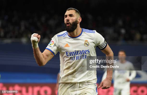 Karim Benzema of Real Madrid celebrates after scoring their team's third goal from the penalty spot during the LaLiga Santander match between Real...