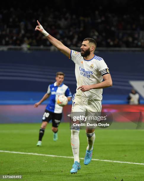 Karim Benzema of Real Madrid celebrates after scoring their team's third goal from the penalty spot during the LaLiga Santander match between Real...