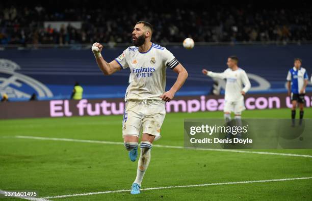 Karim Benzema of Real Madrid celebrates after scoring their team's third goal from the penalty spot during the LaLiga Santander match between Real...