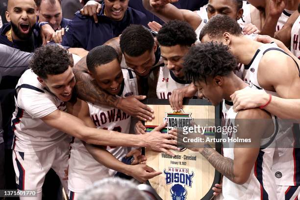 Howard Bison players pose with the plaque after defeating the Morgan State Bears 68-66 during NBA x HBCU Classic Presented by AT&T as part of the...
