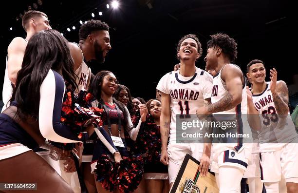 Kyle Foster of the Howard Bison reacts with teammates and cheerleaders after defeating the Morgan State Bears 68-66 during NBA x HBCU Classic...