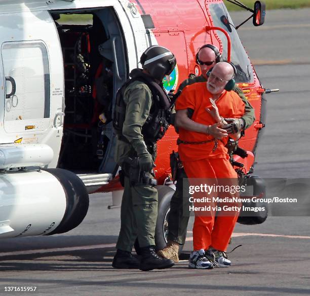 Whitey Bulger is taken from a Coast Guard helicopter to an awaiting Sherif vehicle after attending federal court in Boston. Thursday, June 30, 2011.