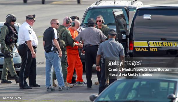 Whitey Bulger is taken from a Coast Guard helicopter to an awaiting Sherif vehicle after attending federal court in Boston. Thursday, June 30, 2011.