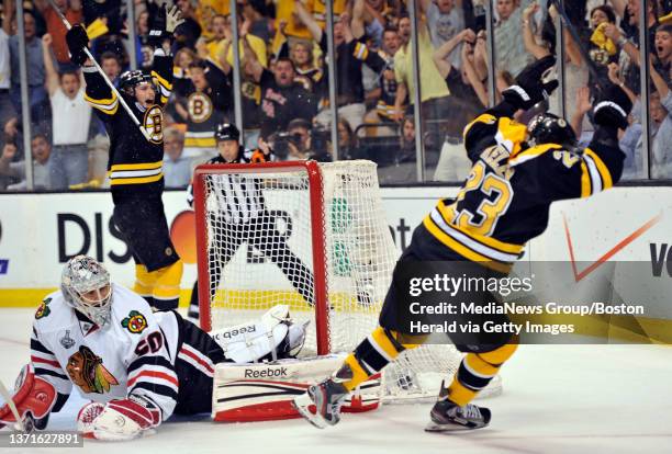 Boston Bruins center Tyler Seguin , left, and Boston Bruins center Chris Kelly celebrate after Kelly scored past Chicago Blackhawks goalie Corey...