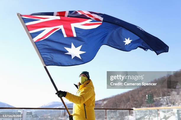 Australian Ski Cross Olympian Sami Kennedy-Sim poses with the Australian flag after being announced Australian flag bearer for the closing ceremony...