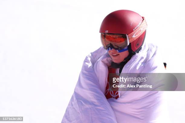 Mikaela Shiffrin of Team United States reacts following her run during the Mixed Team Parallel 1/2 Finals on day 16 of the Beijing 2022 Winter...