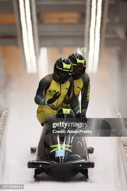 Shanwayne Stephens, Ashley Watson, Rolando Reid and Matthew Wekpe of Team Jamaica finish their slide during the four-man Bobsleigh heat 3 on day 16...