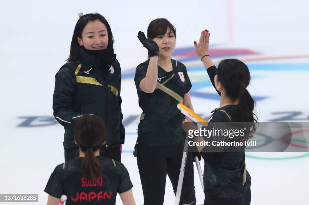 Yurika Yoshida and Chinami Yoshida of Team Japan high five as Yumi Suzuki and Satsuki Fujisawa look on during the Women's Gold Medal match between...