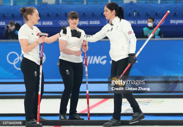 Jennifer Dodds and Eve Muirhead of Team Great Britain bump fists during the Women's Gold Medal match between Team Japan and Team Great Britain at...
