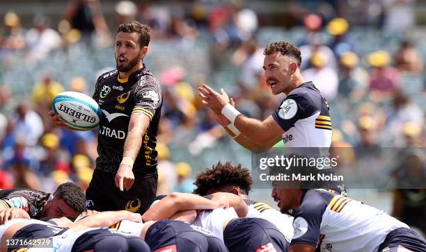 Ian Prior of the Force and Nic White of the Brumbies chat to the referee during the round one Super Rugby Pacific match between the ACT Brumbies and...