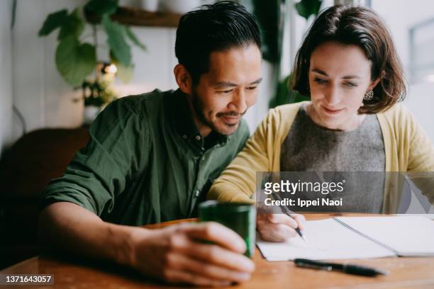 couple planning their future home - budget bildbanksfoton och bilder