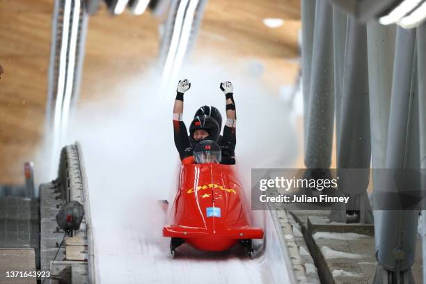 Kaizhi Sun, Qingze Wu, Zhitao Wu and Heng Zhen of Team China react to their slide during the four-man Bobsleigh heat 4 on day 16 of Beijing 2022...