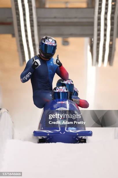 Brad Hall, Taylor Lawrence, Nick Gleeson and Greg Cackett of Team Great Britain react to their slide during the four-man Bobsleigh heat 4 on day 16...