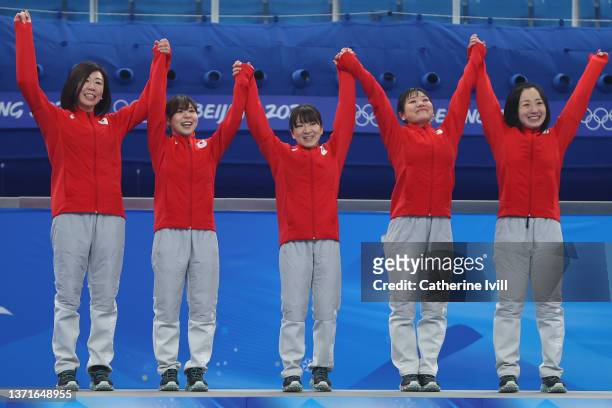 Silver medalists Kotomi Ishizaki, Yurika Yoshida, Yumi Suzuki, Chinami Yoshida and Satsuki Fujisawa of Team Japan celebrate on the podium during the...