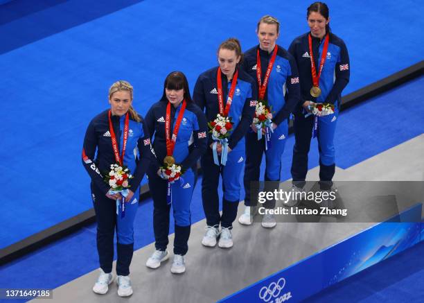 Gold medal winners Milli Smith, Hailey Duff, Jennifer Dodds, Vicky Wright and Eve Muirhead of Team Great Britain stand on the podium during the medal...