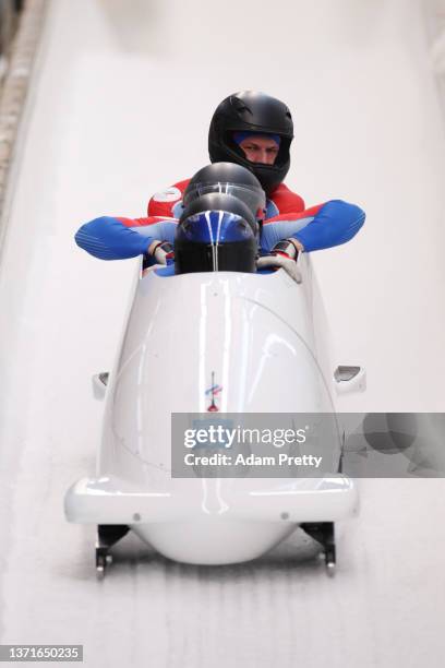 Rostislav Gaitiukevich, Mikhail Mordasov, Pavel Travkin and Aleksei Laptev of Team ROC react to their slide during the four-man Bobsleigh heat 4 on...