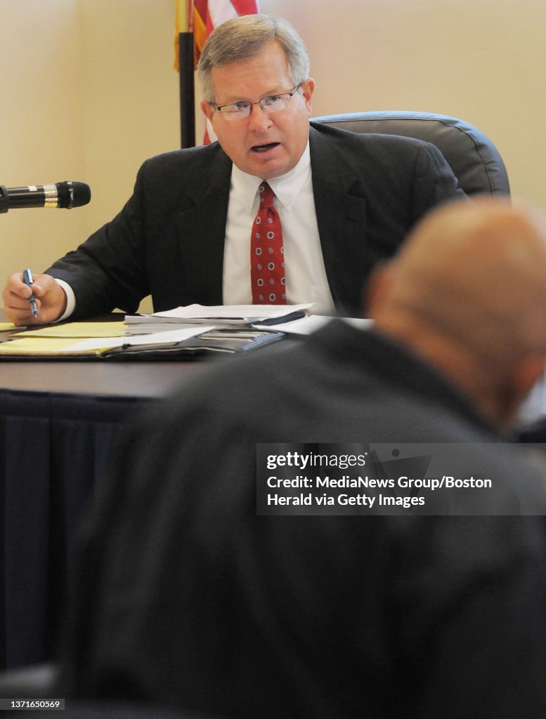 Natick, MA -Parole Board Member John Bocon (T) questions parole applicant Kevin Coe (B) who was convicted of the 1980 second degree murder of Frank Sikorsky as Coe appears before the parole board. 072111. Staff Photo by Patrick Whittemore.