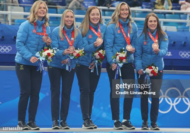 Bronze medal winners Johanna Heldin, Sofia Mabergs, Agnes Knochenhauer, Sara McManus and Anna Hasselborg of Team Sweden stand on the podium with...