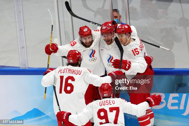 Mikhail Grigorenko of Team ROC celebrates his goal with teammates in the first period during the Men's Ice Hockey Gold Medal match between Team...