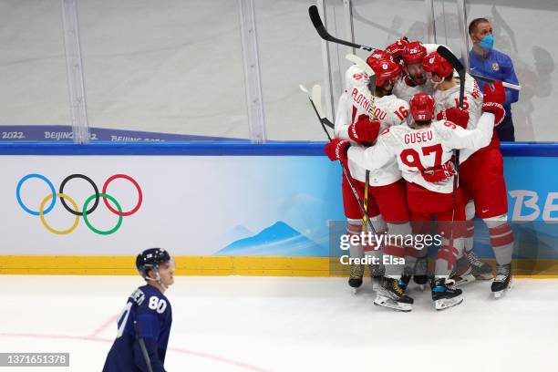 Mikhail Grigorenko of Team ROC celebrates his goal with teammates in the first period during the Men's Ice Hockey Gold Medal match between Team...