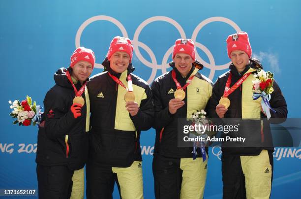 Gold medallists Francesco Friedrich, Thorsten Margis, Candy Bauer and Alexander Schueller of Team Germany stand on the podium after the four-man...