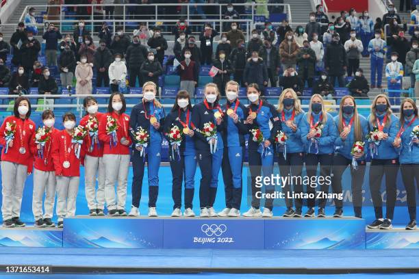 Silver medalists Kotomi Ishizaki, Yurika Yoshida, Yumi Suzuki, Chinami Yoshida and Satsuki Fujisawa of Team Japan; Gold medal winners Milli Smith,...
