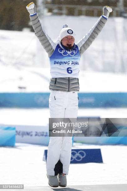 Bronze medallist Kerttu Niskanen of Team Finland celebrates during the Women's 30km Mass Start Free flower ceremony during the Women's Cross-Country...