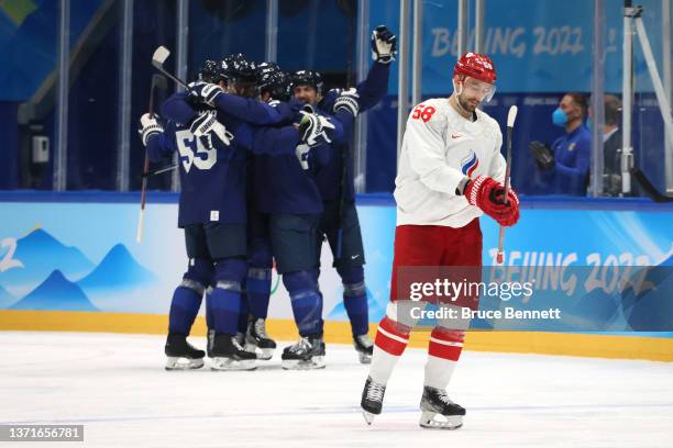 Ville Pokka of Team Finland celebrates with teammates after his goal in the second period during the Men's Ice Hockey Gold Medal match between Team...