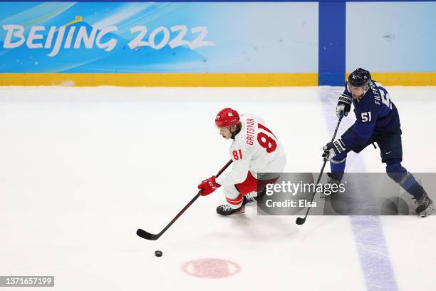 Arseni Gritsyuk of Team ROC controls the puck as Valtteri Filppula of Team Finland defends in the second period during the Men's Ice Hockey Gold...