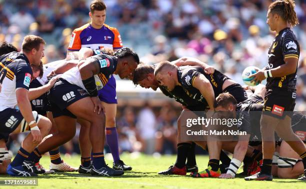 Alan Alaalatoa of the Brumbies and Tom Robertson of the Force prepare to pack a scrum during the round one Super Rugby Pacific match between the ACT...