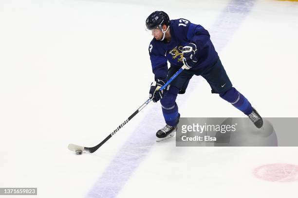 Valtteri Kemilainen of Team Finland controls the puck at the blue line in the second period during the Men's Ice Hockey Gold Medal match between Team...