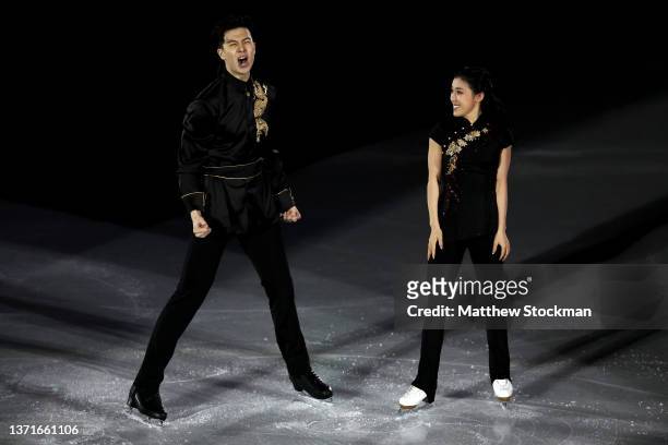 Shiyue Wang and Xinyu Liu of Team China react during the Figure Skating Gala Exhibition on day sixteen of the Beijing 2022 Winter Olympic Games at...