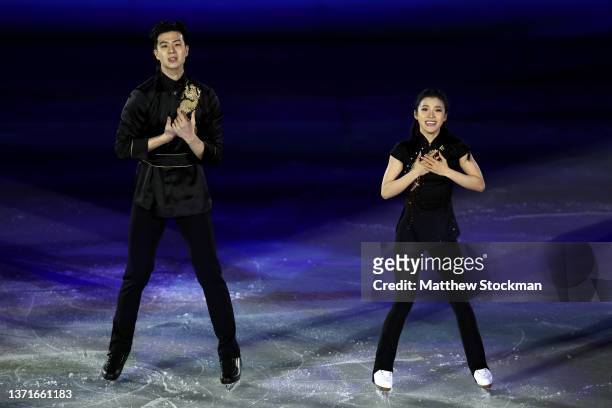 Shiyue Wang and Xinyu Liu of Team China react during the Figure Skating Gala Exhibition on day sixteen of the Beijing 2022 Winter Olympic Games at...