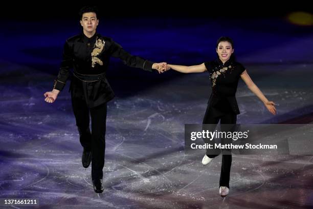 Shiyue Wang and Xinyu Liu of Team China react during the Figure Skating Gala Exhibition on day sixteen of the Beijing 2022 Winter Olympic Games at...