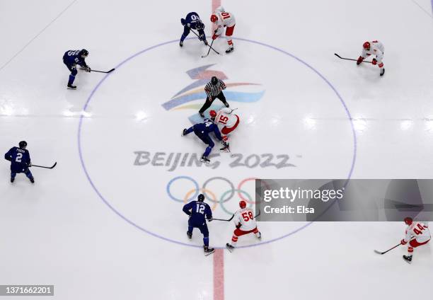 Hannes Bjorninen of Team Finland and Pavel Karnaukhov of Team ROC faceoff at center ice in the third period during the Men's Ice Hockey Gold Medal...