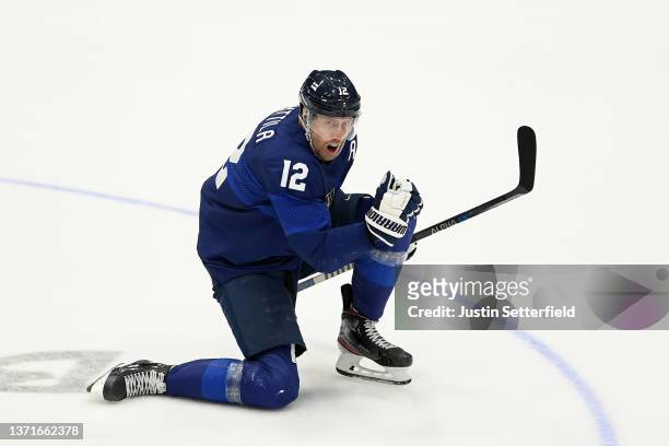 Marko Anttila of Team Finland celebrates a goal scored by Hannes Bjorninen in the third period during the Men's Ice Hockey Gold Medal match between...