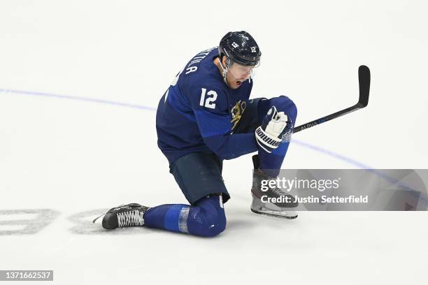 Marko Anttila of Team Finland celebrates a goal scored by Hannes Bjorninen in the third period during the Men's Ice Hockey Gold Medal match between...