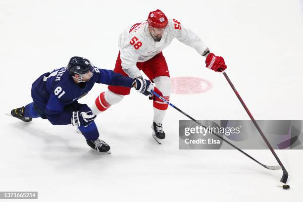 Iiro Pakarinen of Team Finland defends against Anton Slepyshev of Team ROC in the third period during the Men's Ice Hockey Gold Medal match between...